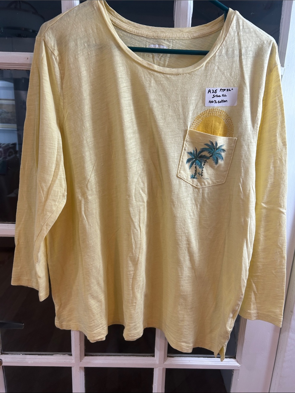 A25.    Old Navy Light Yellow Long-Sleeve Pocket Tee with Palm Tree Graphic